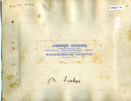 Back of mounted photograph has stickers and the producer's details