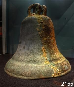 Brass church bell in typical bell shape, with inverted 'U' shaped fittings on top