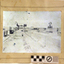 Sepia photograph, mounted, with the large steam crane on a construction site