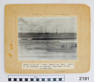 Black and white photograph mounted on cream card. Handwritten and printed labels.