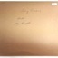 Rear of photograph has inscriptions (incorrect ship name) and sticker
