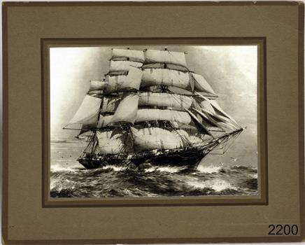 Brown frame around a sepia sailing ship in sailing rig