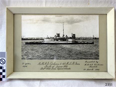 Ship in foreground, docked, buildings in background. Gift to H.M.A.S. Cerberus Museum