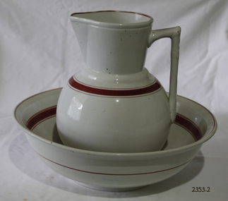 Cream coloured jug and bowl with brown trim