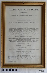 Gilt framed document with printed text . Frame has a hole in top and bottom centre of frame.