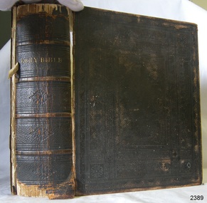 Embossed fabric covered hard cover Bible with gold lettering