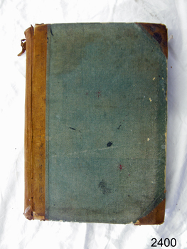 Blue fabric covered hardcover record book with reinforced spine and corners