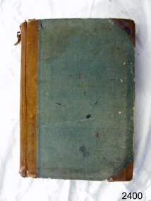Blue fabric covered hardcover record book with reinforced spine and corners