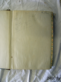 Right edges of pages have alphabetical index. Fly page has pencil figures and marks