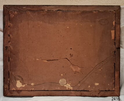 Wooden frame with paper-covered wooden backboard, wire attached to eyelet screws, inscriptions on back.