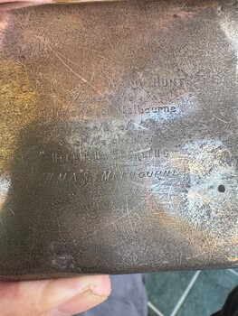 Close up of the inscription on the silver cigarette case presented to Commander Hunt