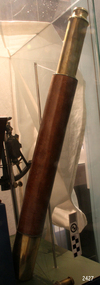 Long, timber and leather covered telescope, standing at an angle
