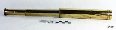Small brass telescope, collapsible, three draw.