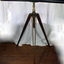 Wood and metal long telescope mounted on a wooden tripod