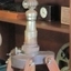 Metal fitting has an adjustable concave sleeve along the telescope's centre, and further adjustments at the pedestal
