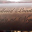 Engraved inscription in cursive script "Dollond London, Day or Night"