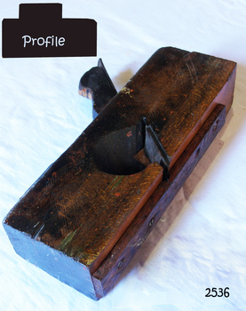 Wooden plane with blade and guard over base