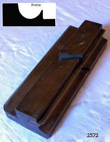 Wooden plane with coating of varnish. No blade.