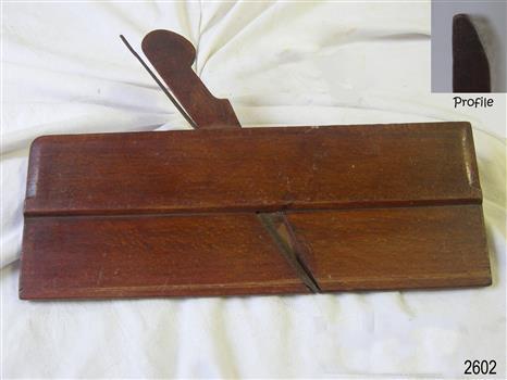 Rectangular wooden tool, stained and lacquered surface, with a wooden and an metal attachment