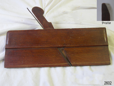 Rectangular wooden tool, stained and lacquered surface, with a wooden and an metal attachment