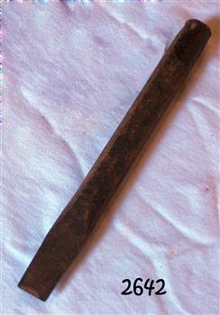 Long metal rod with four flattened sides tapering to a wedge shape with a thin end