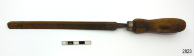 File has wooden handle and is three-sided.