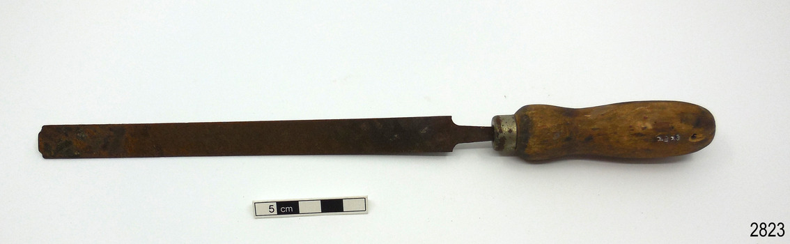 File has a brass collar between handle and file.