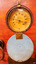 Dial with brass frame and measurements in pressure and feet, blue cover plate open.