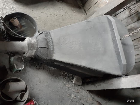 Bellows from above showing its full length from nozzle to supporting chain