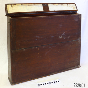 Narrow, wide timber box with hinged flip top lid and dowel around the base as extra support