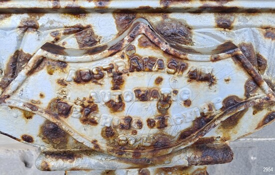 Molded shield and inscription with the scale manufacturer's name