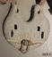Weight has several holes for fixing belts, ropes and straps. It is curved to fit against the body