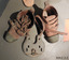 boots have a thick sole, metal toe caps, leather body and three leather straps that buckle around the ankles.
