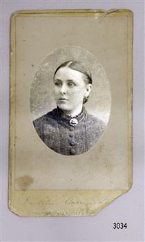 Rectangular card with oval frame matte around the portrait of a woman