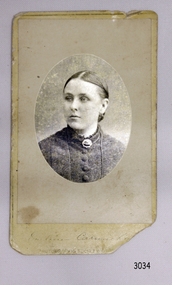 Rectangular card with oval frame matte around the portrait of a woman
