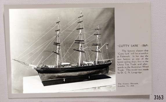 Black and white photograph of Cutty Sark, sails down, text containing brief details