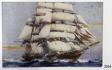 The coloured postcard shows a tall, fully rigged ship, close to land.