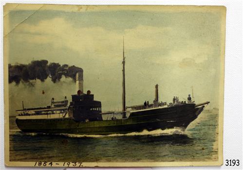 Rectangular photograph of a steam ship, smoke coming from funnel. Coloured yellow-green.