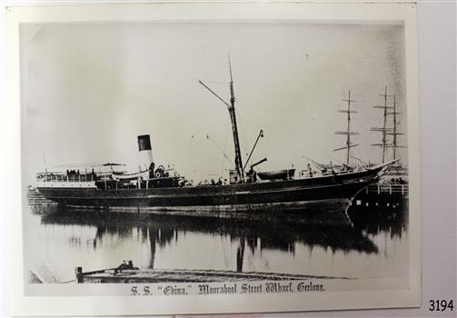 Rectangular black and white photograph of a steam ship
