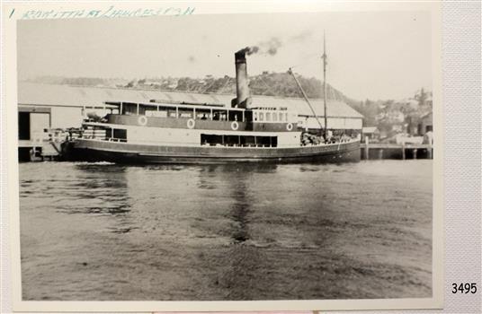 Black and white photograph with handwritten blue inscription