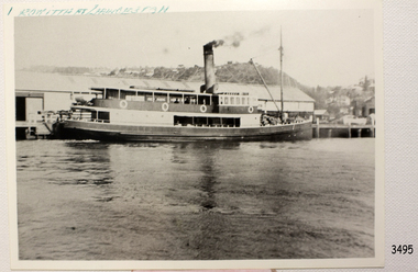 Black and white photograph with handwritten blue inscription