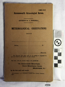 Brown cardboard cover with printed text