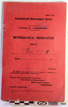 Book with red cardboard cover, black print and handwritten entries