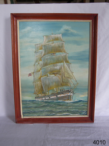 Painting of a tall sailing ship, mounted in a red-brown frame