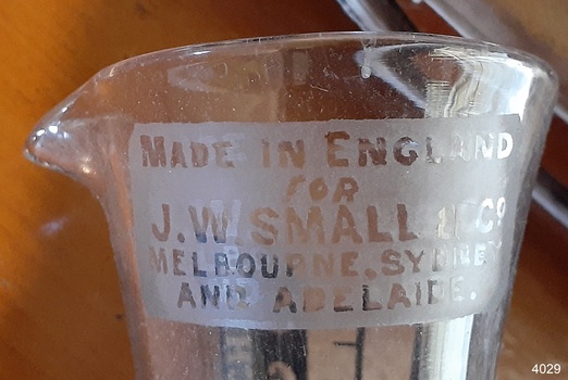 Close-up of opaque label with information about maker and importer.