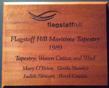 The engraved plaque recognises the crafts people who created the work.