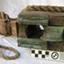Wooden block with metal sheave and short length of rope attached