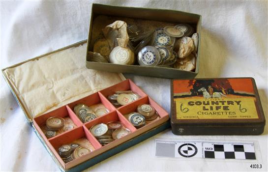 Three boxes of different sizes of watch glasses