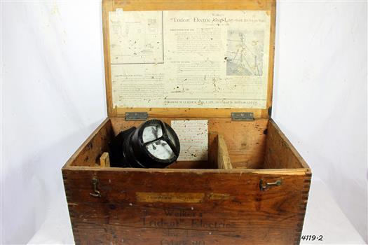 The wooden box has compartments for the metal log and accessories
