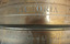 Close-up of engraved text on cylinder
